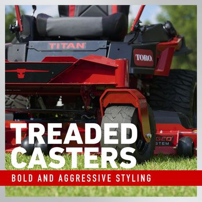 Red Toro lawn mower with treaded casters on grass