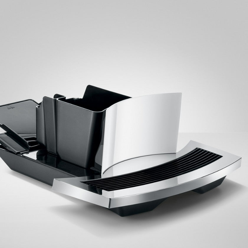 Modern kitchen knife block with black and silver design on a light gray background