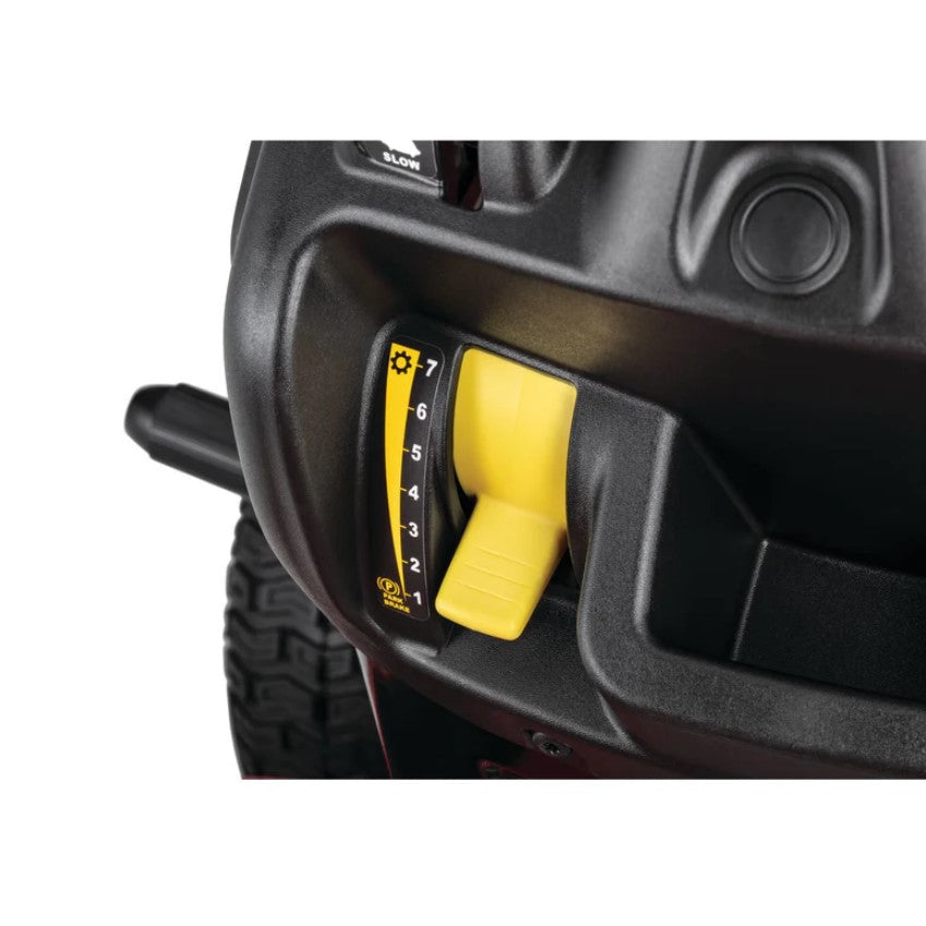 Close-up of a black lawn mower with a yellow throttle control on a white background