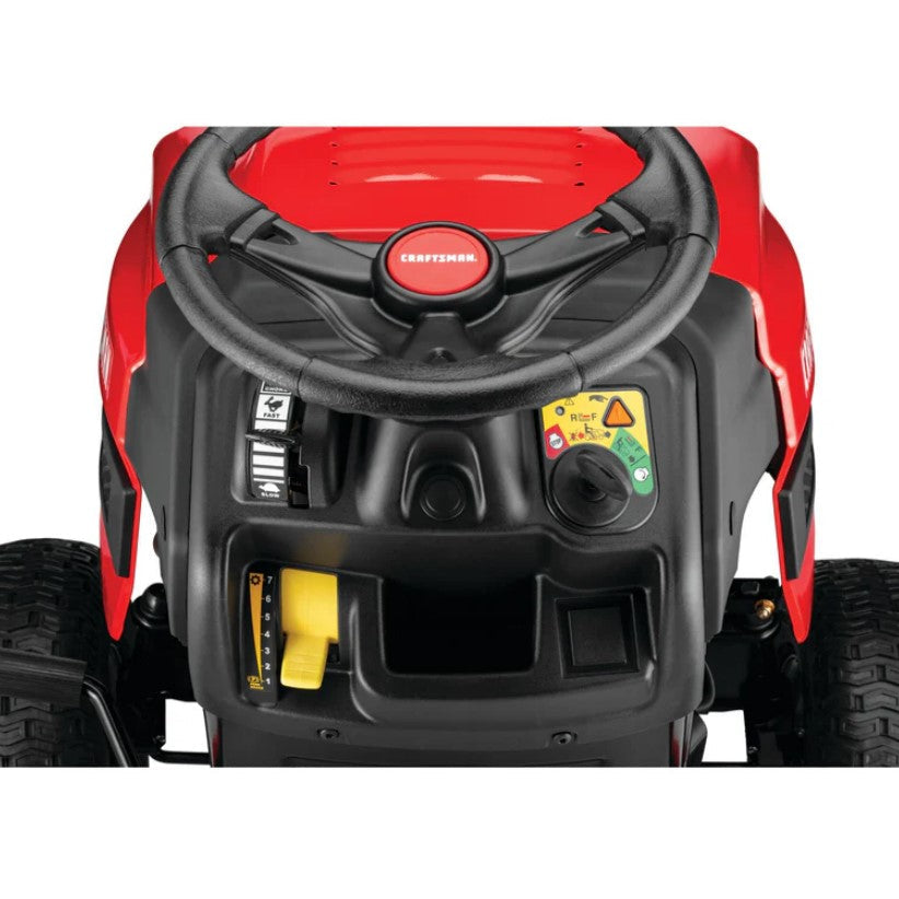 Close-up of a red and black lawn mower engine with visible brand logo on a white background