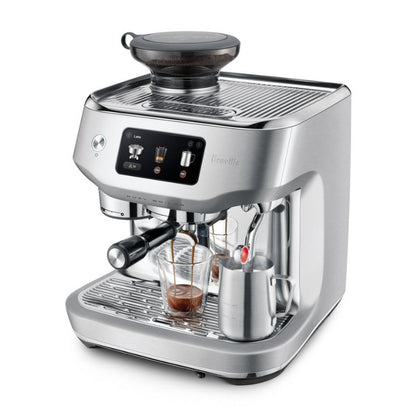Silver Breville espresso machine on a white background