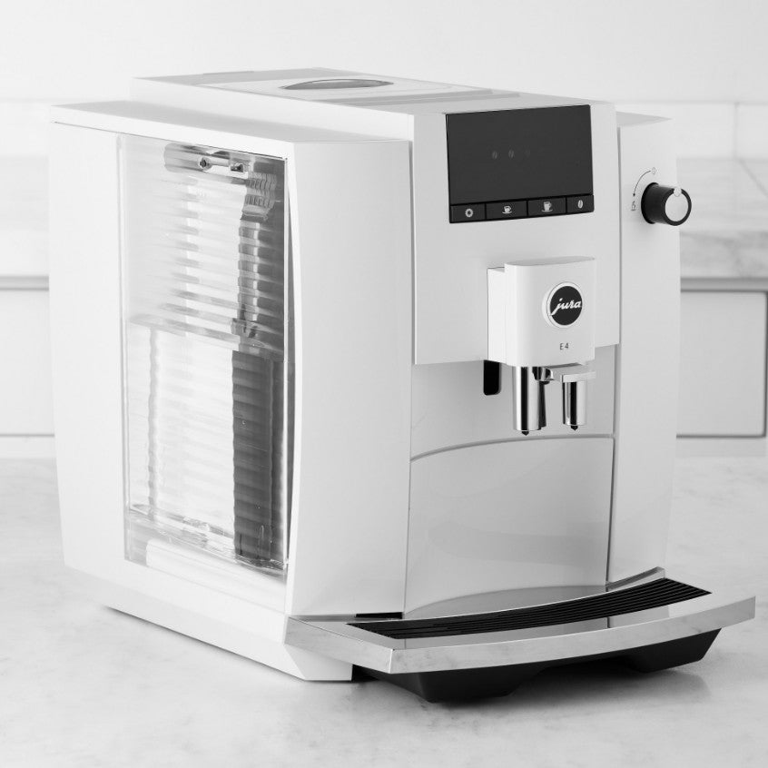 White coffee machine on a light gray background