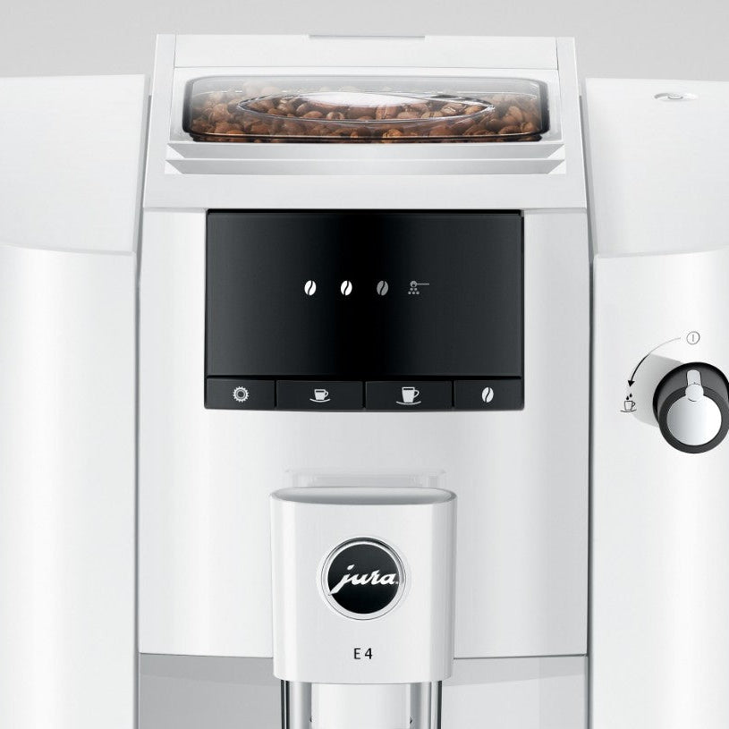 White coffee machine with a screen and control panel, featuring the Jura brand logo.