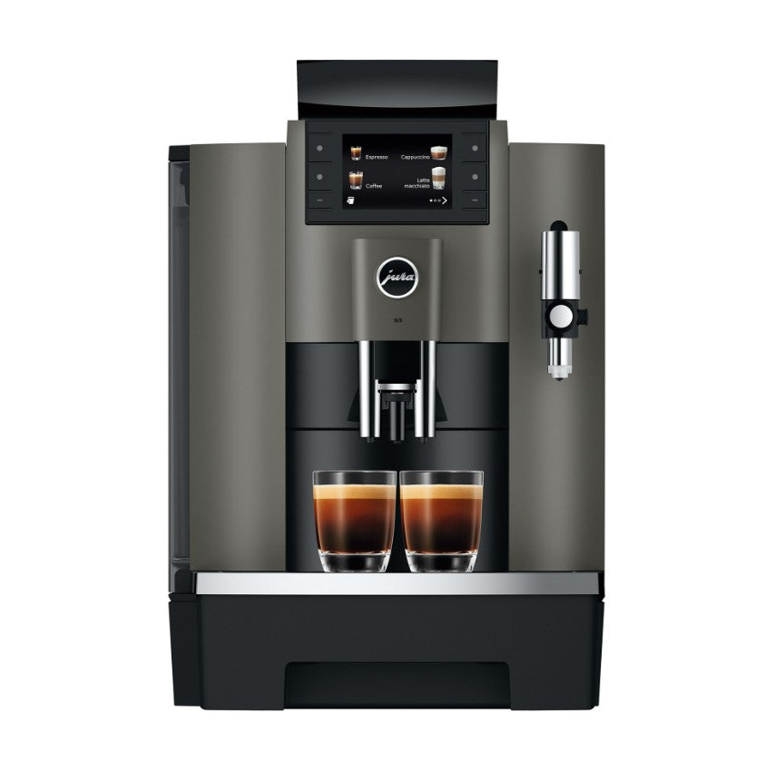 Modern coffee machine with two cups of coffee on a white background
