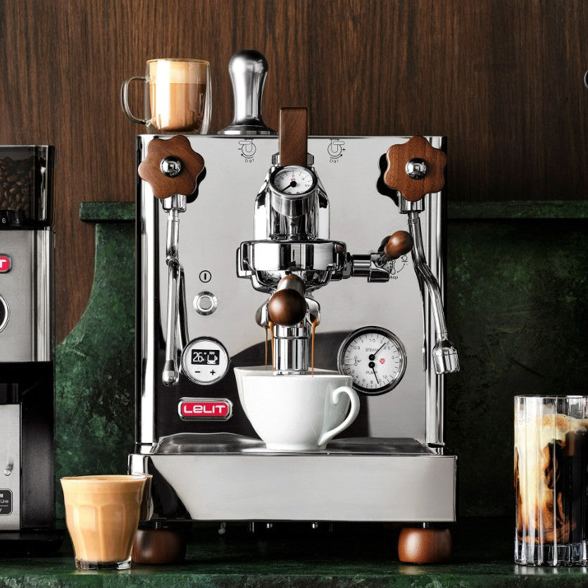 Espresso machine with a cup of coffee on a wooden background