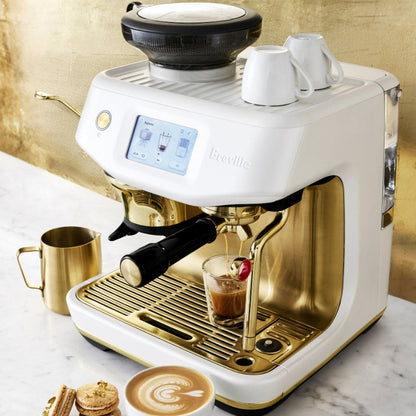 Breville coffee machine with a cup of coffee on a marble surface