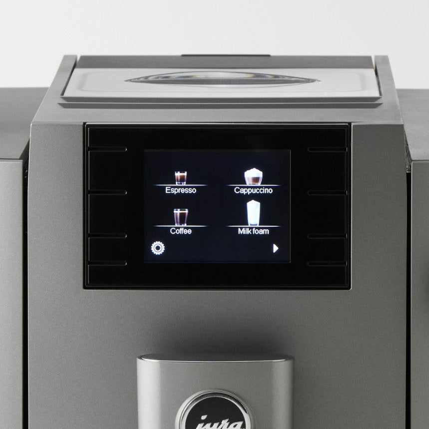 Coffee machine with digital display showing coffee options on a white background