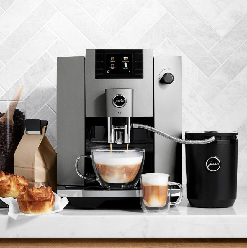 Coffee machine with a cup of coffee on a kitchen counter