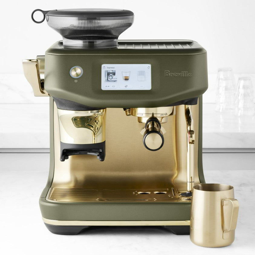 Green and gold Breville coffee machine on a white background