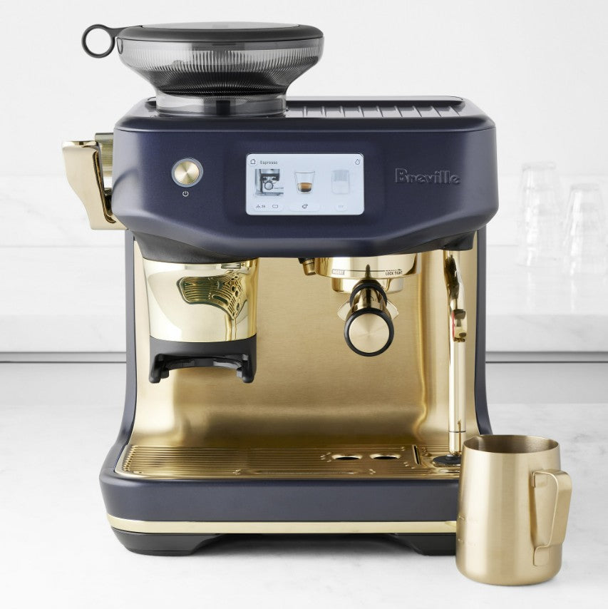 Breville coffee machine with a gold cup on a white background