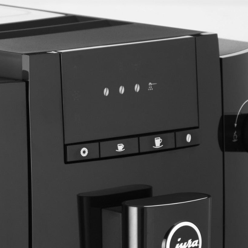 Black coffee machine with control panel and Iwata logo