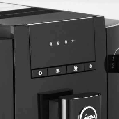 Black coffee machine with control panel and Iwata logo
