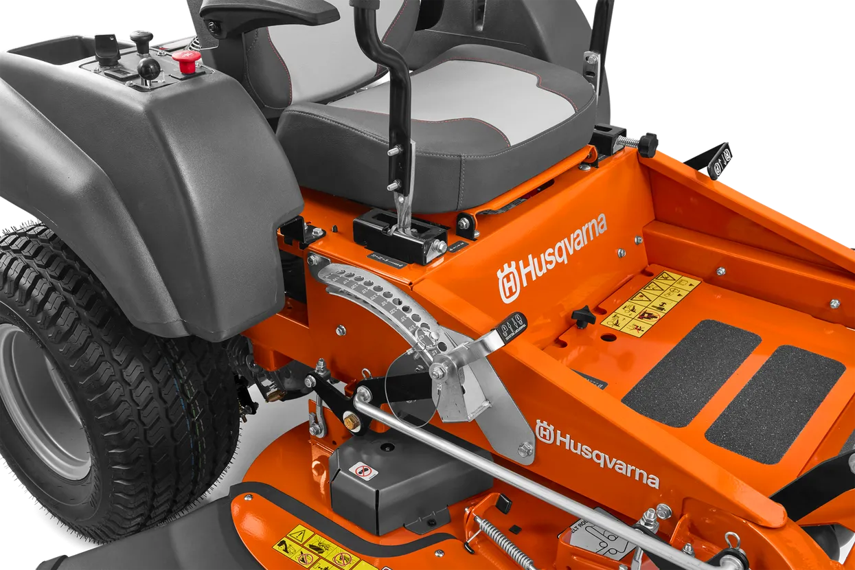 Close-up of an orange Husqvarna riding lawn mower on a white background