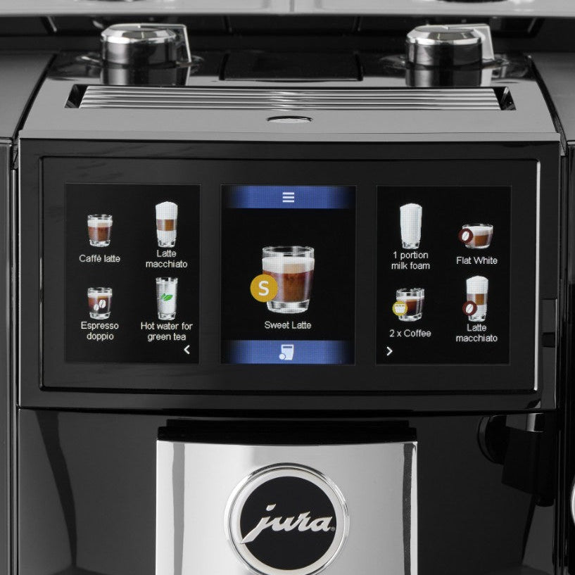 Coffee machine with a digital display showing various coffee options, featuring the Jura brand.