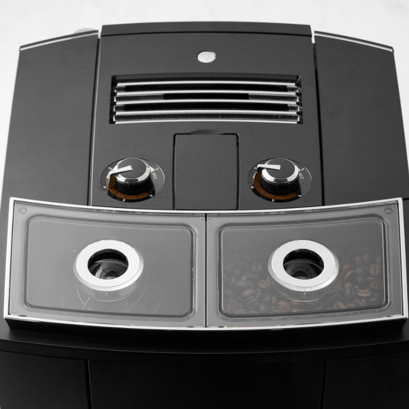 Black and silver electronic device with two circular components on a white background