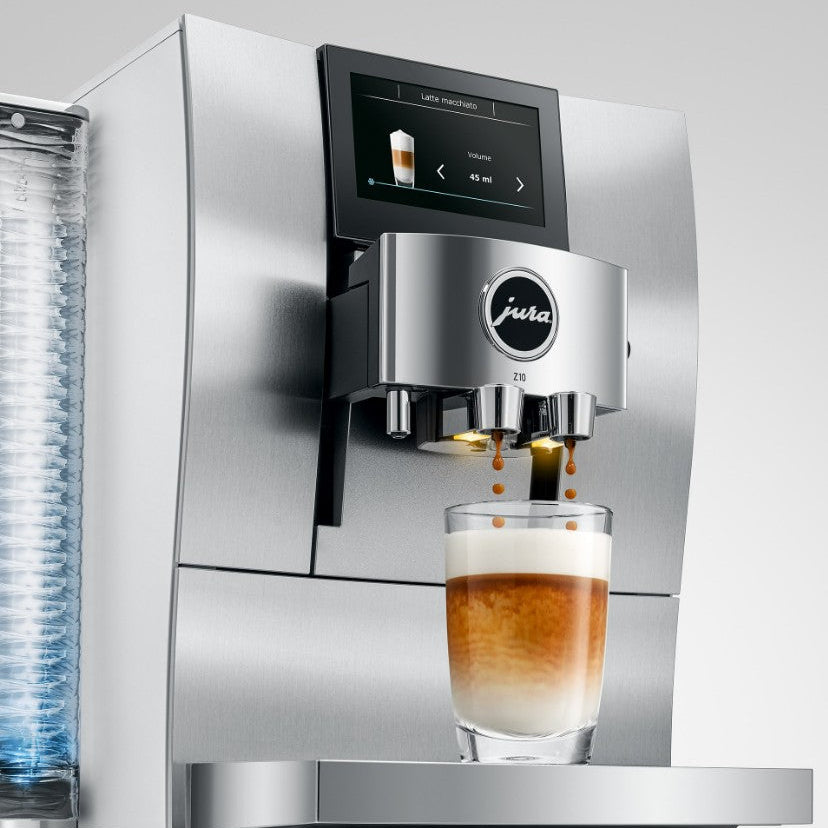 Jura coffee machine dispensing a glass of coffee