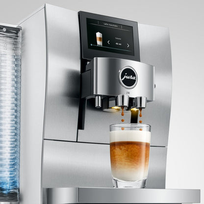 Jura coffee machine dispensing a glass of coffee
