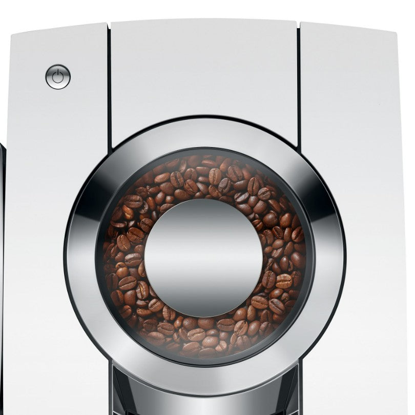 Coffee grinder with coffee beans inside on a white background