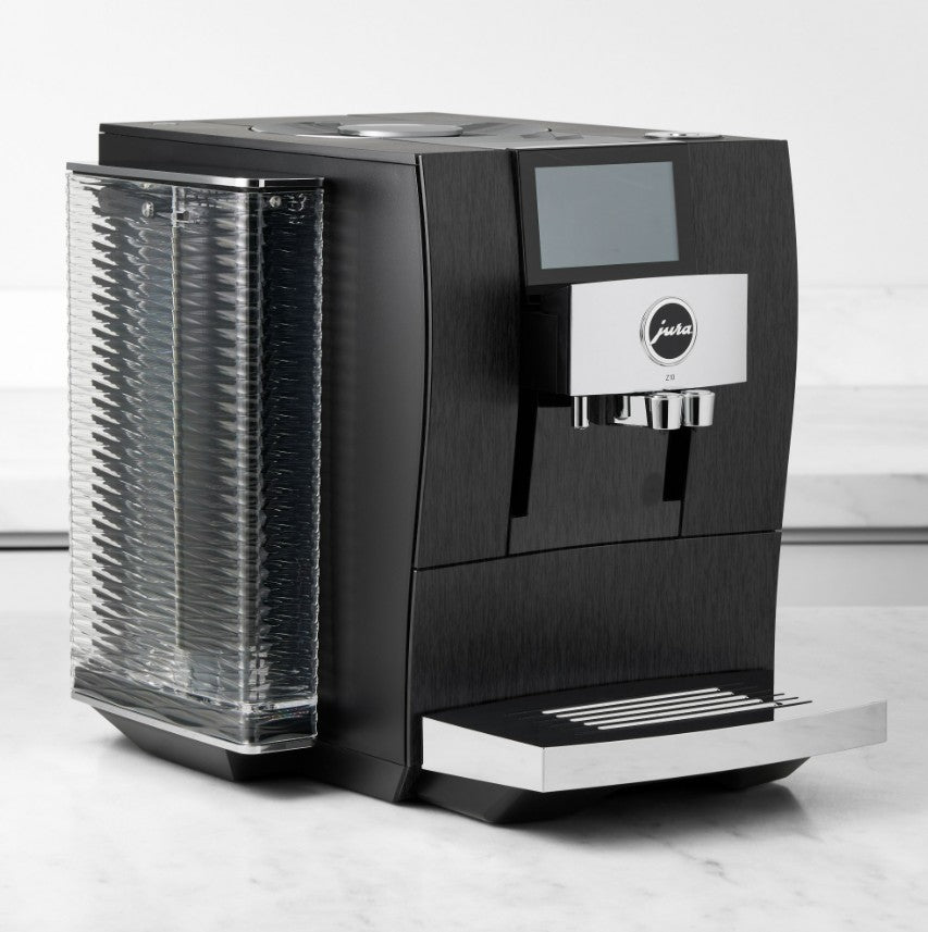 Black coffee machine with a digital display on a white background