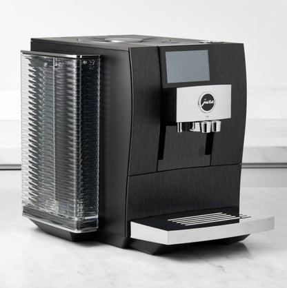 Black coffee machine with a digital display on a white background