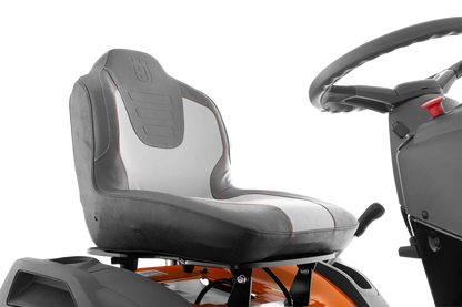 Gray seat and steering wheel of a lawn mower on a white background