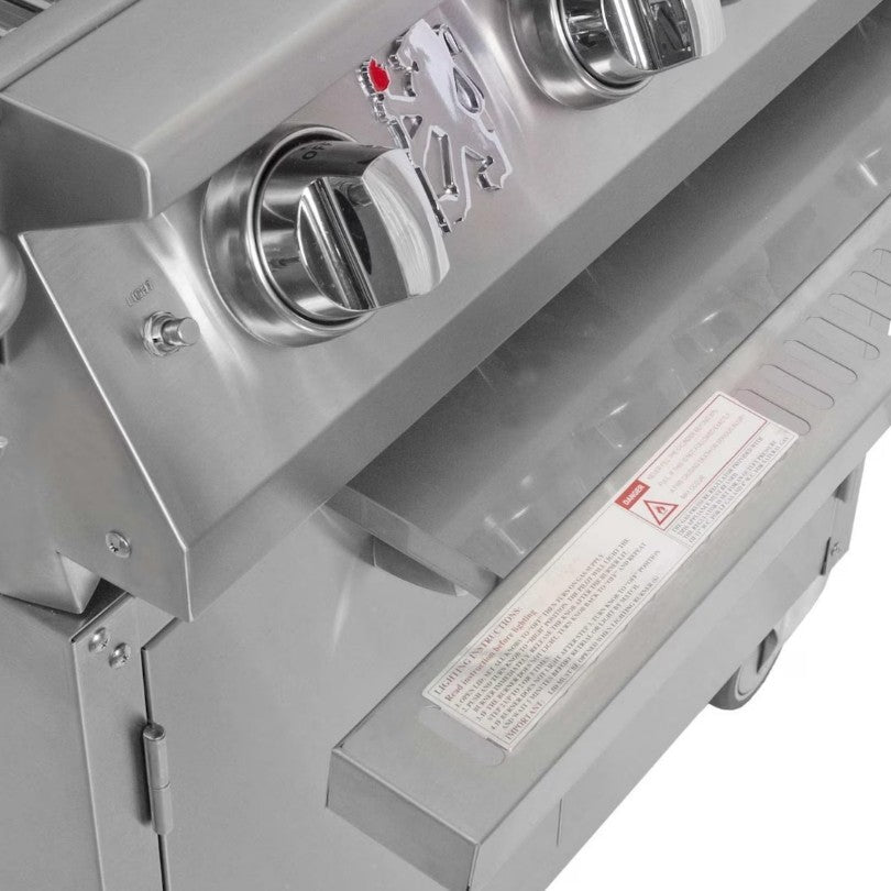 Close-up of a gas grill with control knobs and brand logo.