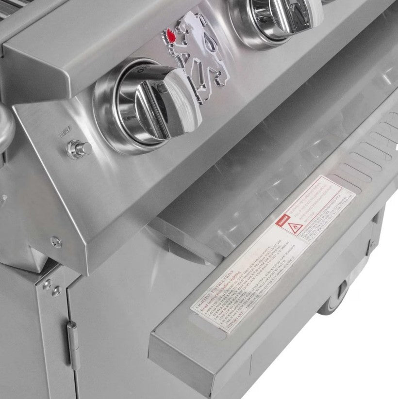 Close-up of a stainless steel grill with control knobs and a brand logo.