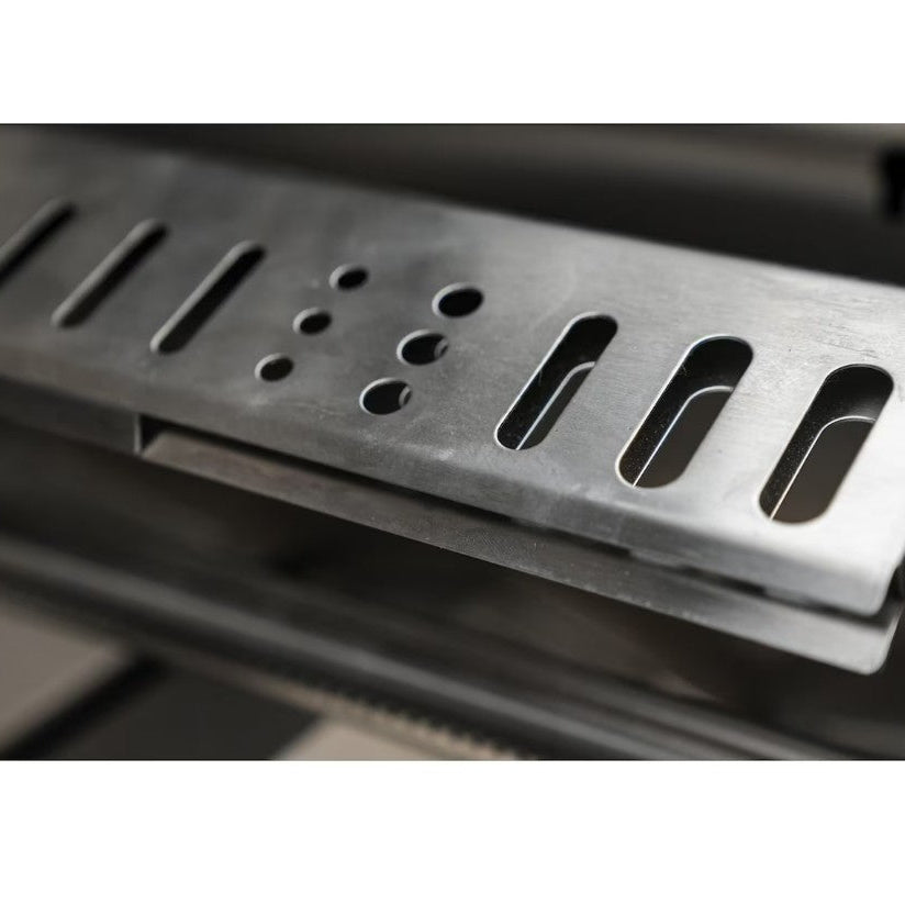 Metallic grill grate on a blurred background