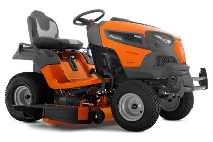 Orange and black riding lawn mower on a white background