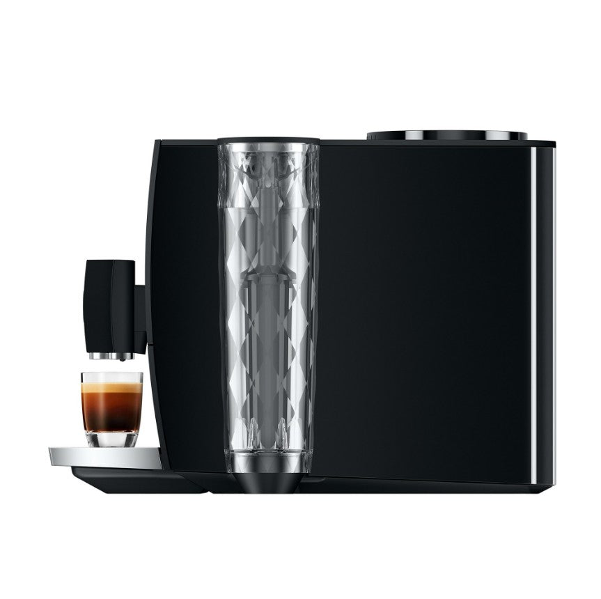 Black coffee machine with a glass of coffee on a white background