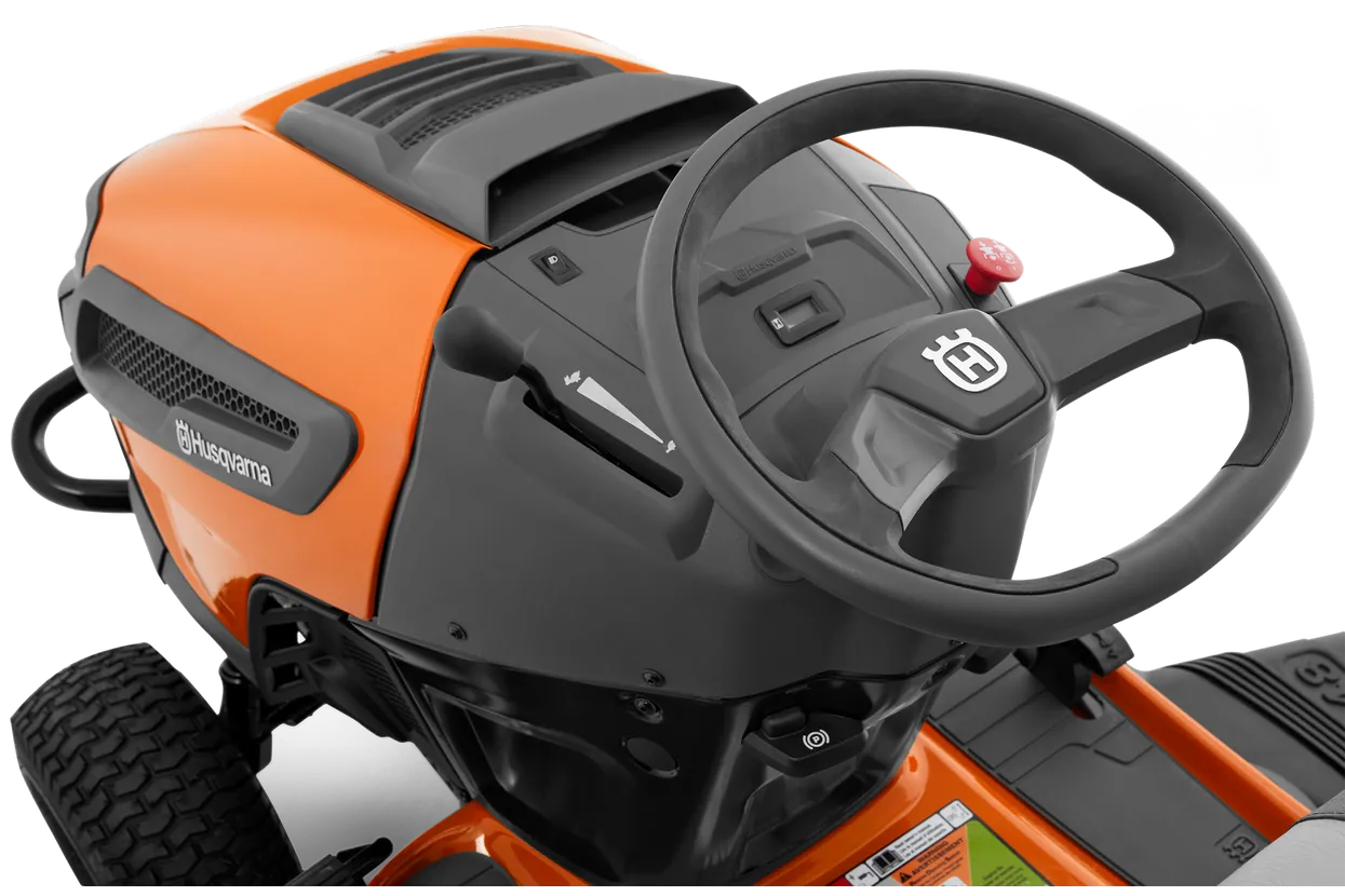 Close-up of a Husqvarna lawn mower with steering wheel on a white background
