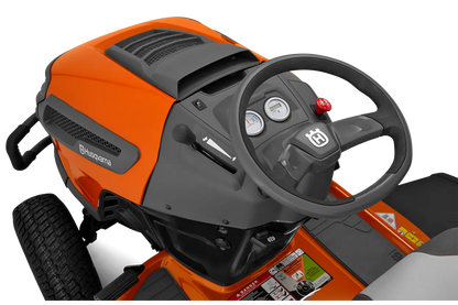 Orange and black lawn mower with steering wheel on a white background